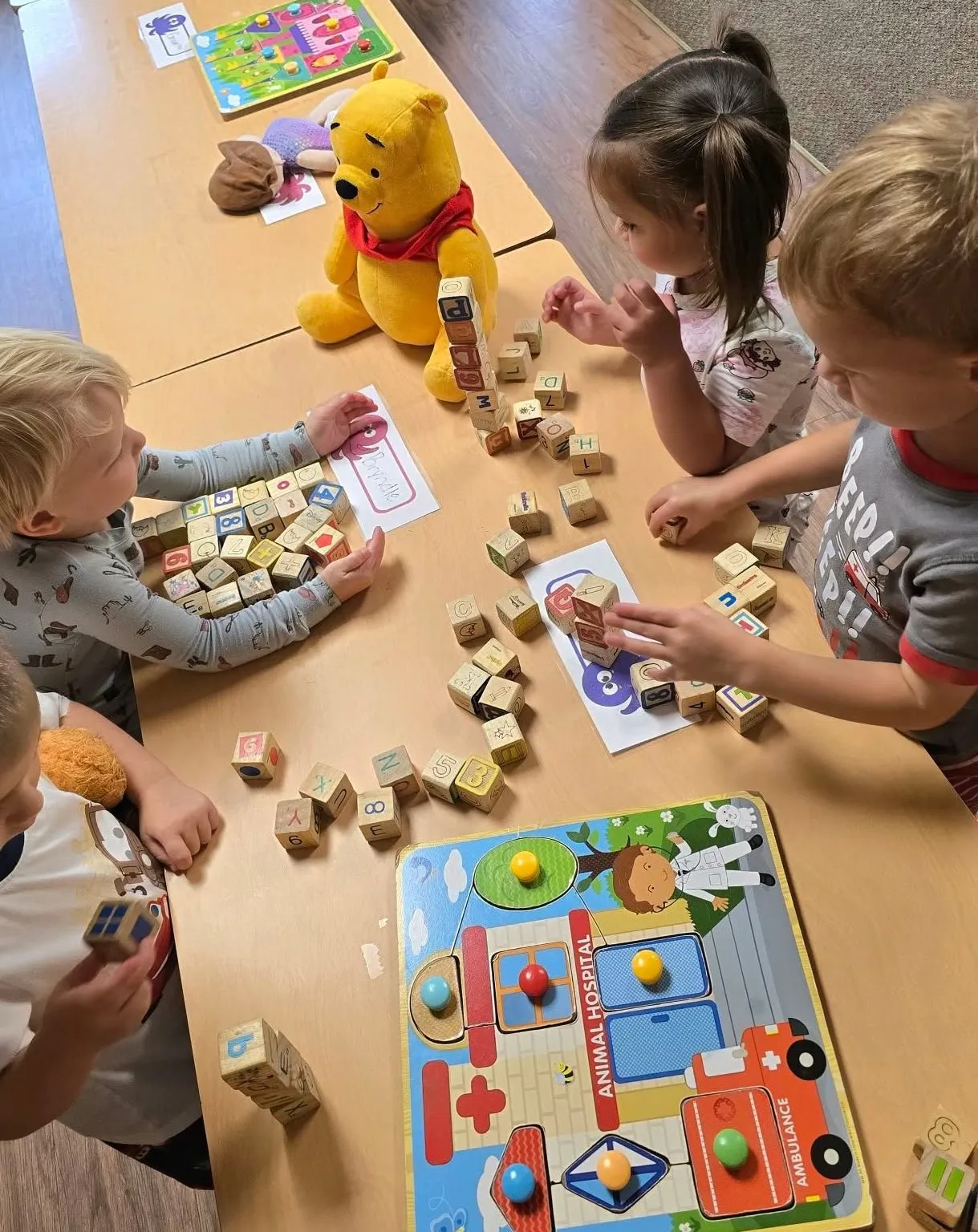 Children learning and playing together with blocks at Highland PDO