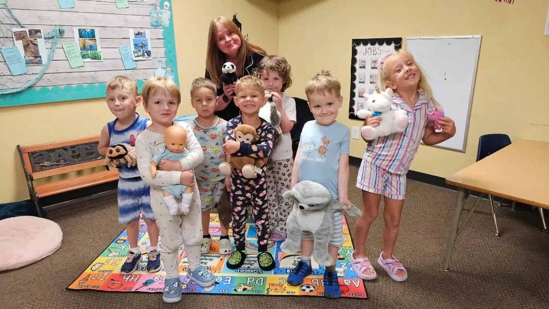 A Highland PDO teacher with children in a classroom